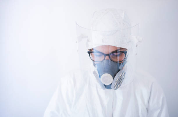 istock Young Beautiful Female Scientist Wearing Protective Equipment During COVID-19. 1266941284