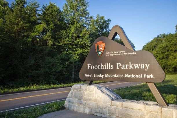 Great Smoky Mountains National Park Foothills Parkway Wears Valley, Tennessee, USA - August 12, 2020: Sign for the newly completed section of the Foothills Parkway. The completed section is 16 miles and runs between Wears Valley and Walland Tennessee and was completed in 2018. tennessee road sign stock pictures, royalty-free photos & images