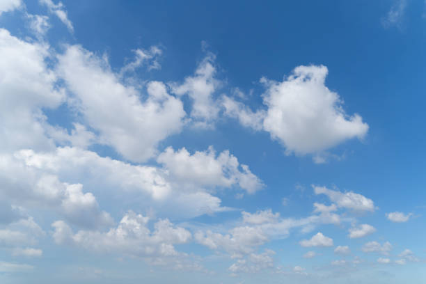 istock Clear blue sky with white fluffy clouds at noon. Day time. Abstract nature landscape background. 1266944487