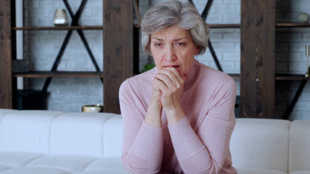 istock Mature senior woman feeling worried about problems, pensive upset sad middle aged grey haired lady looking away thinking of loneliness 1266948672