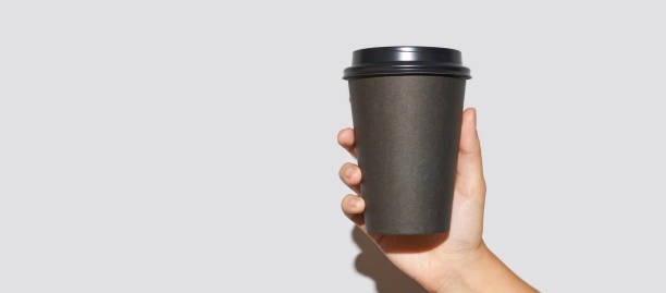 istock Girl hand hold coffee plastic cup 1266948692