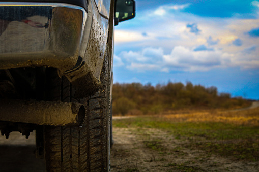 A muddy day with a clear sky is a good cause to cover the truck in mud