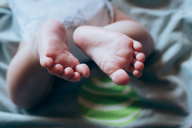 istock Close Up Baby Soles- New Life 1266951888