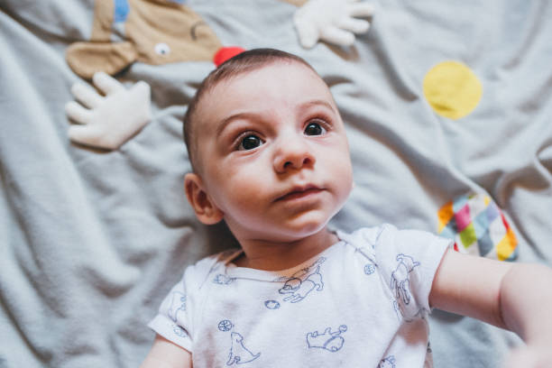 istock Cute little baby boy lying on his back 1266952163
