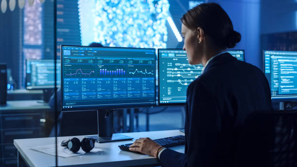 istock Confident Female Data Scientist Works on Personal Computer in Big Infrastructure Control and Monitoring Room with Neural Network. Woman Engineer in an Office Room with Colleagues. 1266953206