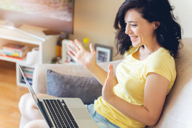 istock Euphoric winner watching a laptop on a sofa winning at home 1266953725