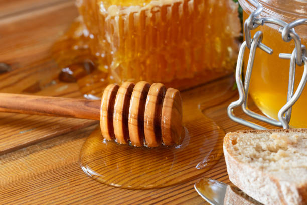 istock organic honey and rustic bread on a old wooden table. Healthy eating breakfast. 1266954968
