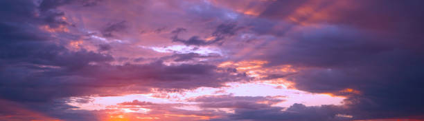 istock Sunset in the clouds. Blue orange purple sunset background. 1266955687