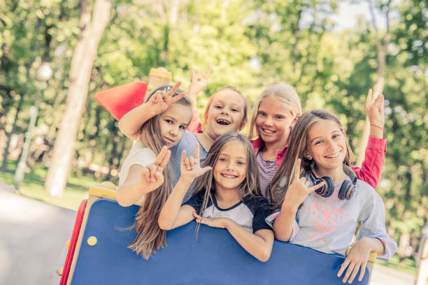istock Little smiling girls gesturing 1266956233
