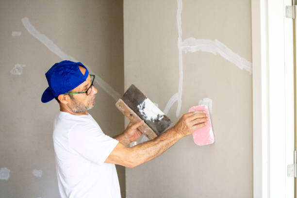 istock old man repairing his home 1266956389