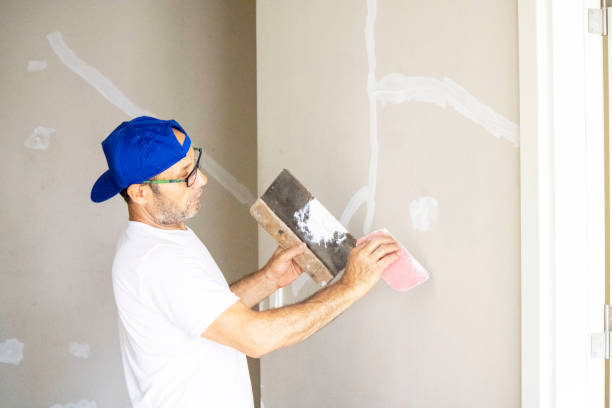 istock old man repairing his home 1266956391