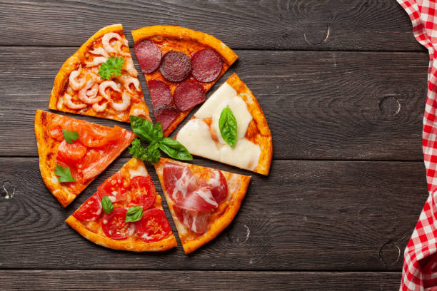 istock Tasty slices of different pizza 1266956472