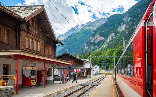 St Niklaus Switzerland , 2 July 2020 : St. Niklaus train station with car train and mountains view during 2020 summer in Valais Switzerland