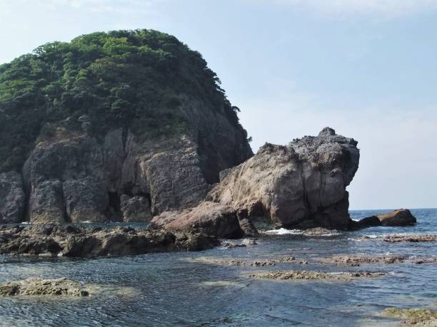 istock Imagoura with Kaeruiwa (Kaeru Rock) which looks like a frog (Sanin kaigan National Park, Japan) 1266960195