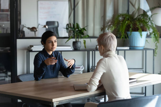 istock Focused young indian job seeker self-presenting on interview. 1266961063