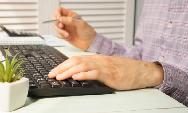 istock Hands of Businessman Notebook and documents working 1266961240
