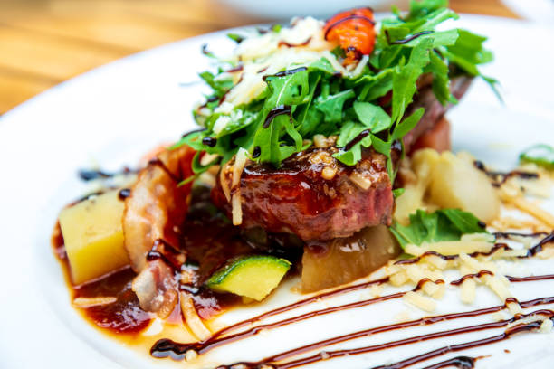 istock juicy steak beef meat with tomato and potatoes 1266961390