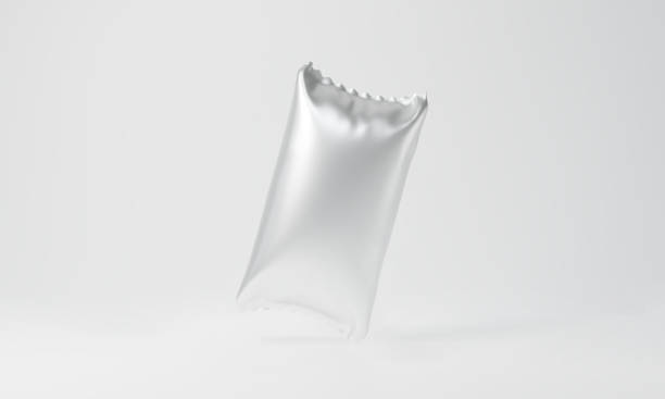 istock Silver package mockup isolated on white background for foil food product design. 3d rendering of blank plastic bag snack packaging or pouch bag chips. Clear sachet pack. 1266961523
