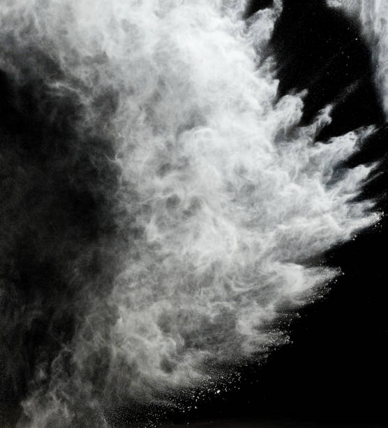 istock cloud of white wheat flour on a black background, particles fly in different directions 1266962696