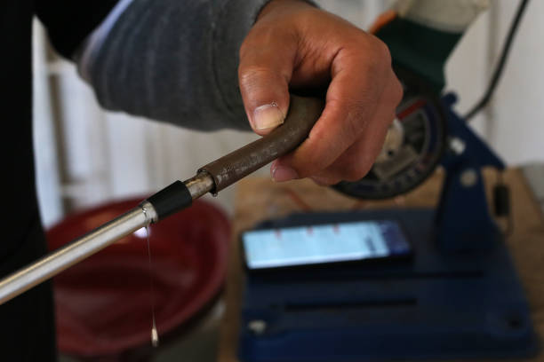 istock Golf Club Builder repairs a golf club 1266962753