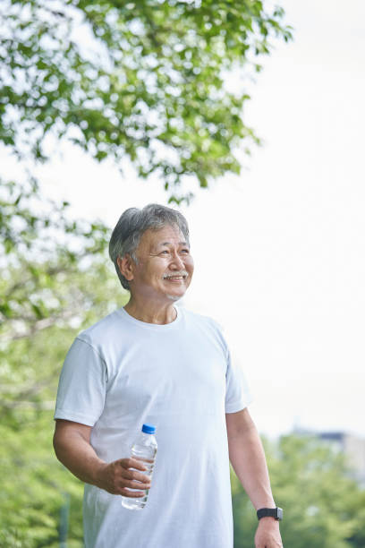 istock Senior man with water in a plastic bottle 1266962964