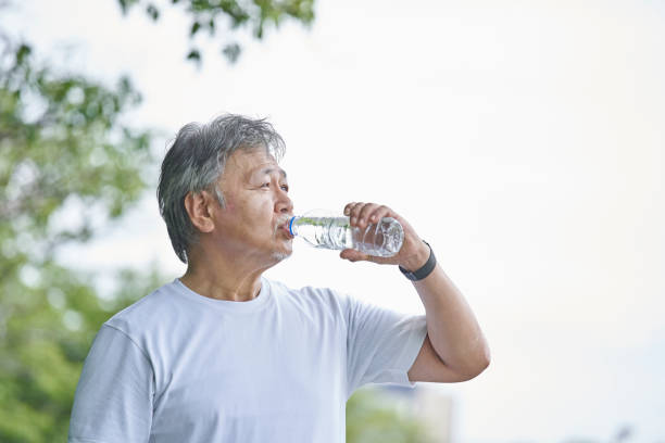 istock Senior man with water in a plastic bottle 1266962969