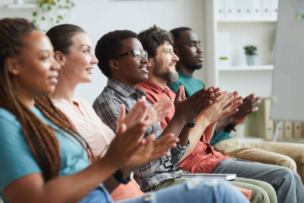 istock Diverse Business People Applauding in Row 1266963296