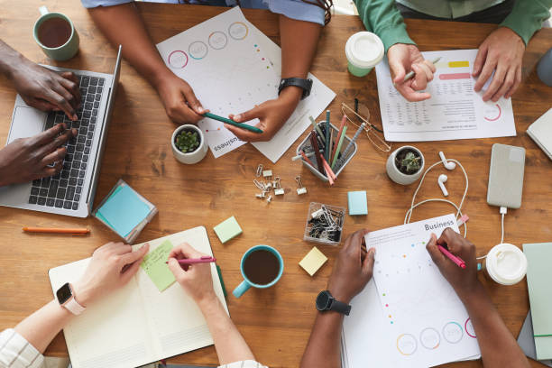 istock Busy Meeting in Office Top View 1266963335