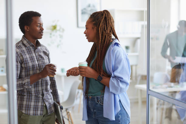 istock African-American Colleagues Chatting at Break 1266963380