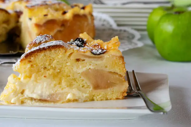 fresh and homemade apple cake or apple pie with a delicious sour cream topping - ready to eat