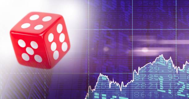 istock Digital illustration of a red dice over graphs and statistics 1266964951