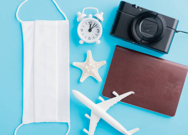 istock minimal model plane, airplane, starfish, compass, smartphone blank screen and face mask 1266967776