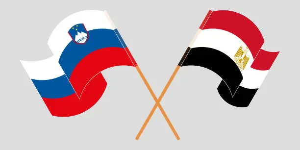 Vector illustration of Crossed and waving flags of Egypt and Slovenia