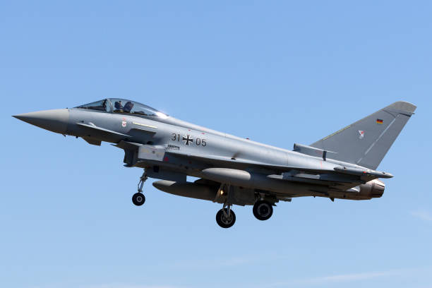 German Air Force Eurofighter Typhoon on approach to land at RAF Fairford. Gloucestershire, UK - July 10, 2014: German Air Force Eurofighter EF-2000 Typhoon multirole fighter aircraft on approach to land at RAF Fairford. german armed forces stock pictures, royalty-free photos & images