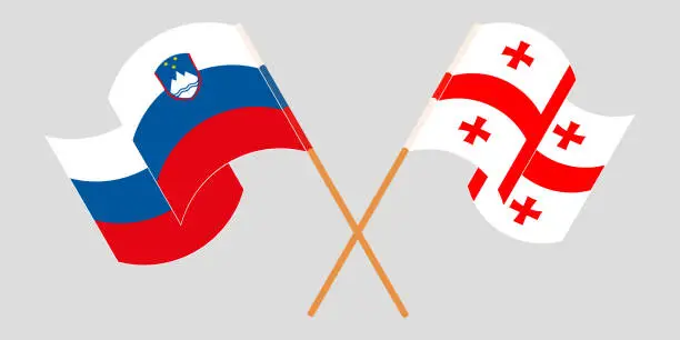 Vector illustration of Crossed and waving flags of Georgia and Slovenia