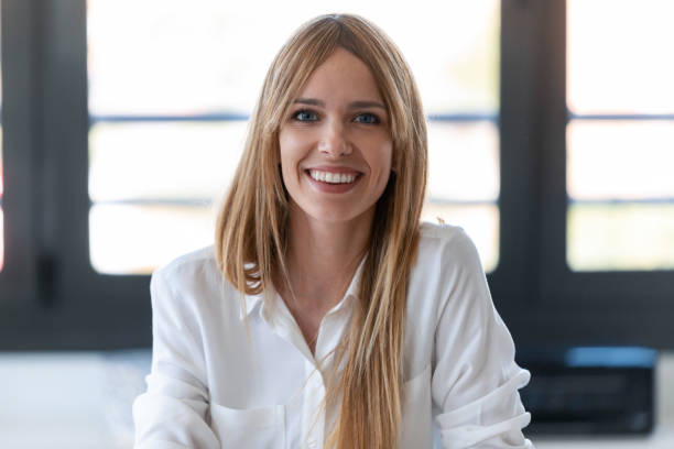 istock Pretty young woman blogger smiling while making social media video 1266968178