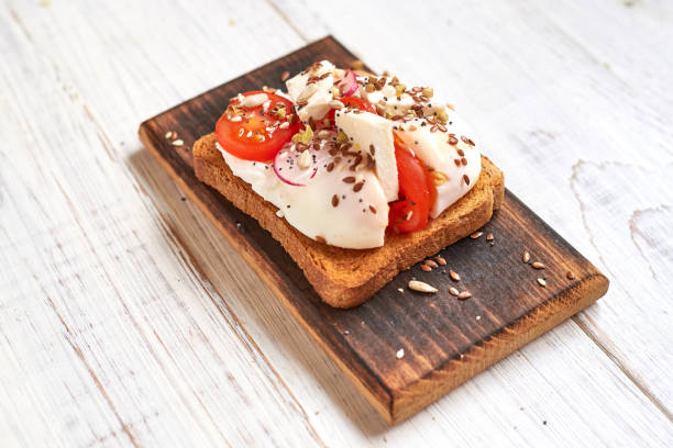 istock Toast with egg, tomatoes, vegetables and spices. 1266968978