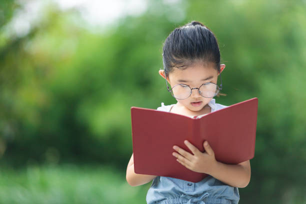istock Little girl with glasses 1266971019