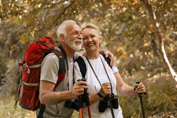 istock Senior couple in woods hiking 1266974555