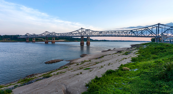 Panoramic view of the four-lane Natchez–Vidalia Bridge (two twin cantilever bridges), crossing the Mississippi River. It carries US 84 into Natchez, seen here just before dusk at Natchez, MS