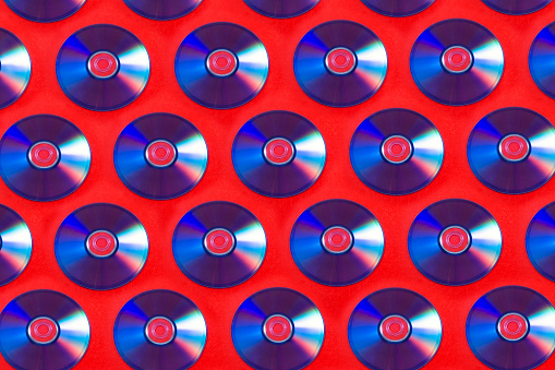Dvd disks on red background