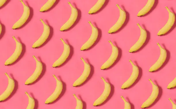 Photo of Banana Pattern on Pink Background