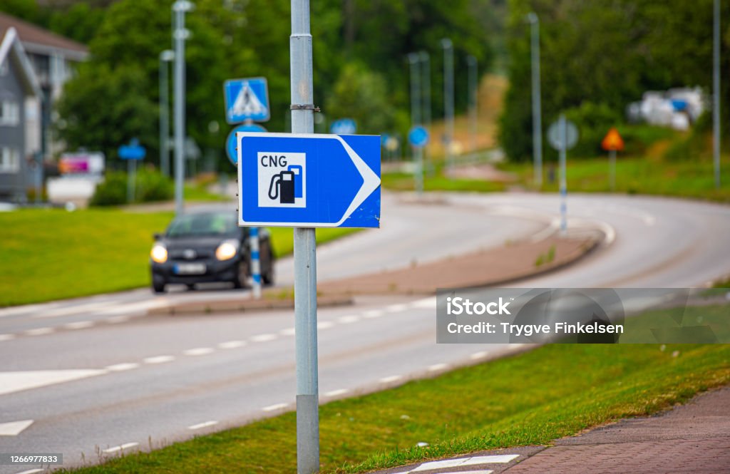 Sign pointing to a CNG filling station Sign pointing to a CNG filling station. Truck Stock Photo