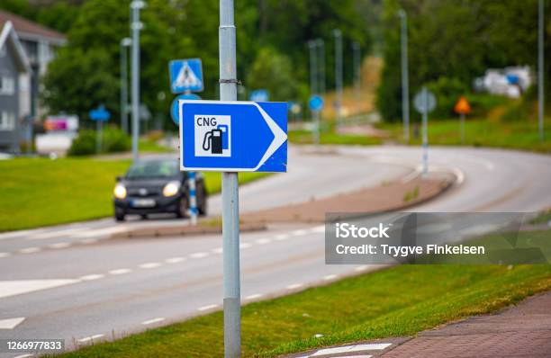 Sign Pointing To A Cng Filling Station Stock Photo - Download Image Now - Truck, Fuel and Power Generation, Propane