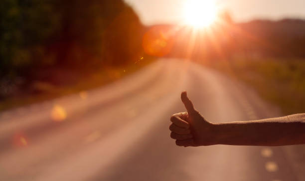istock Woman's hand at the car stop 1266978862