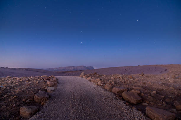 istock Footpath, Mount Ardon, and stars, in Makhtesh (crater) Ramon 1266980699