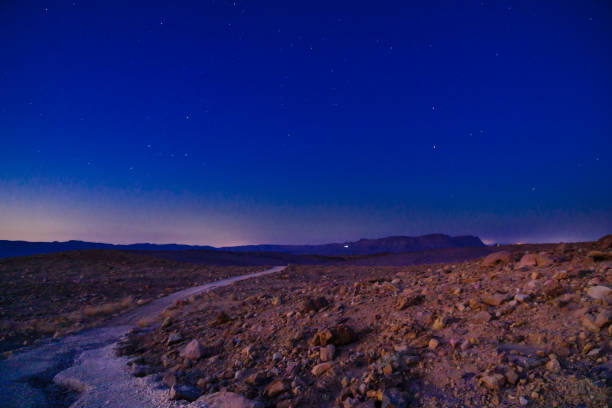 Footpath, Mount Ardon, and stars, in Makhtesh (crater) Ramon