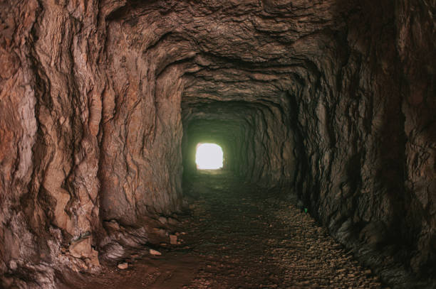 istock a nature dark tunnel through mountain to a cave 1266981233