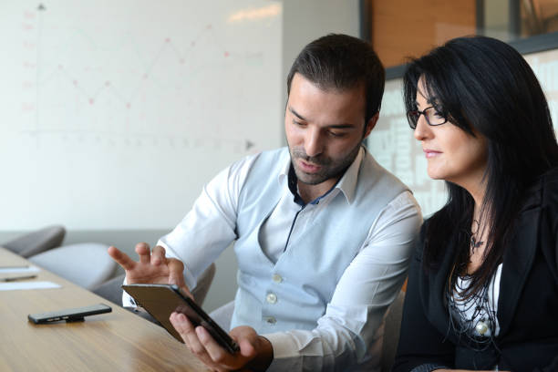 istock Business couple meeting in office 1266982084