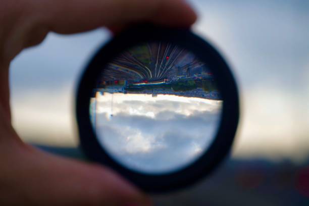 istock Reflected upside down views of railway tracks through a lens 1266986160